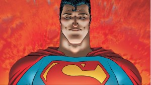 Superman, looking down with a smile, with red clouds behind him